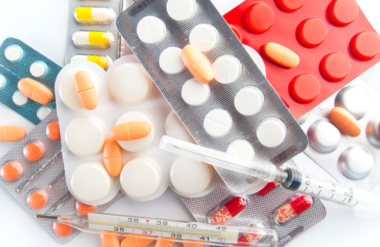 Safe Handling of Medicines Various tablets, capsules, syringes, and blister packs arranged together.