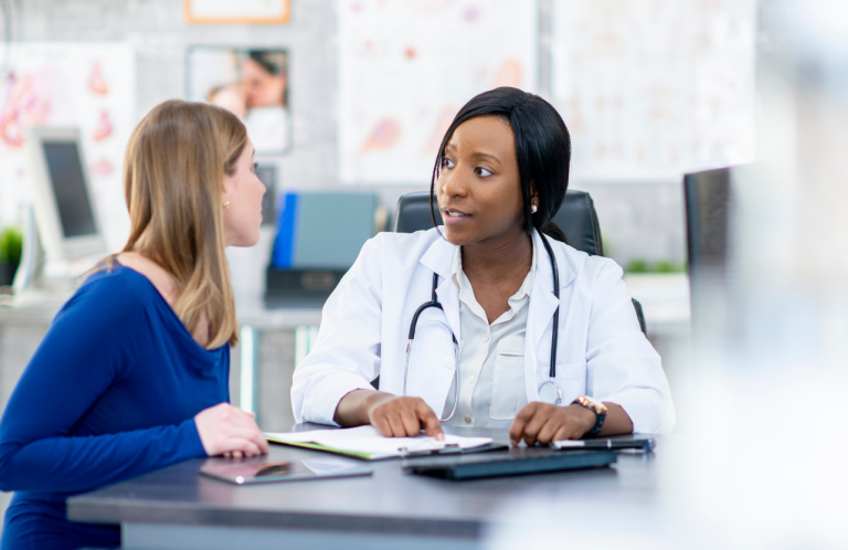 Clinical Supervision for Supervisors A healthcare professional consults with a patient in a clinical setting.